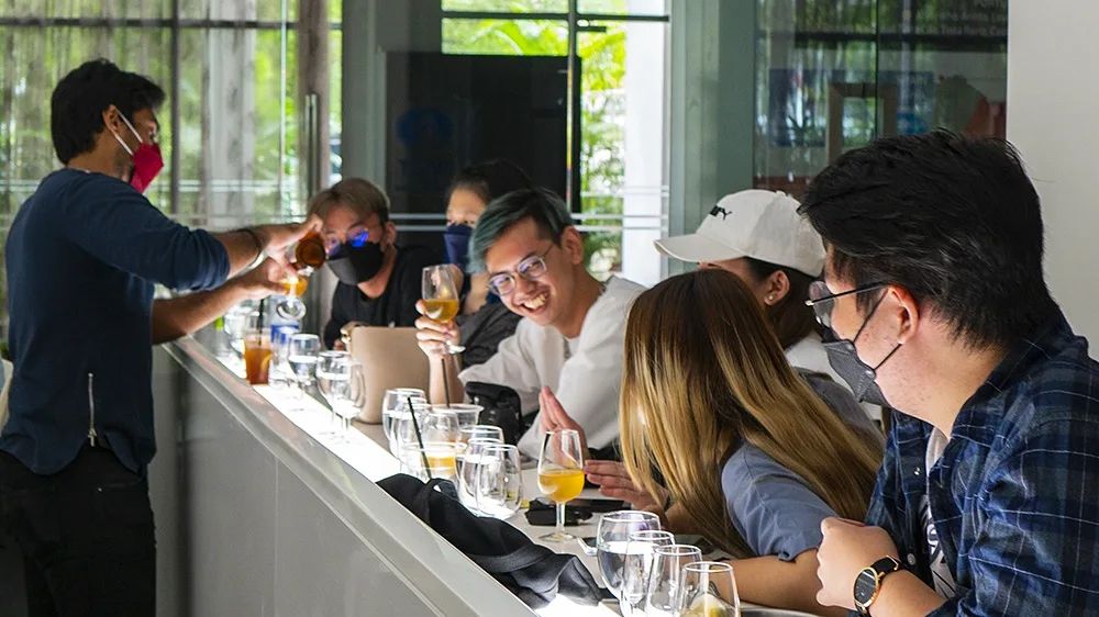 People drinking craft beer at a bar